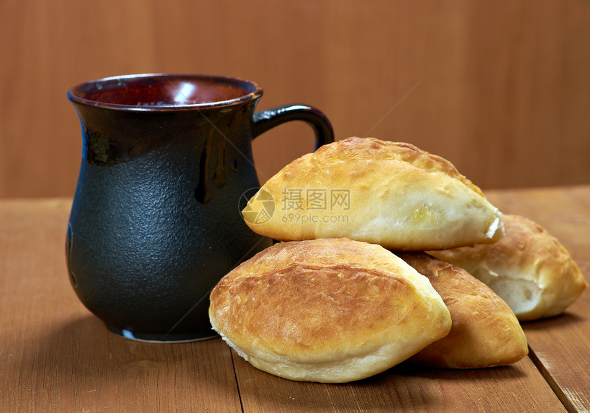 卢西亚传统皮革 家庭蛋糕甜点馅饼饺子馒头小吃面包食物糊状木头图片