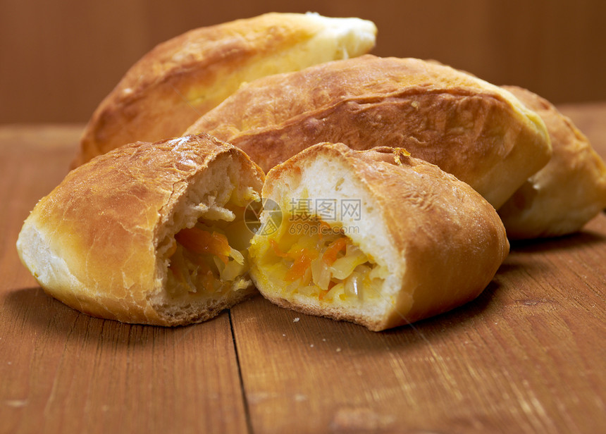 卢西亚传统皮革 家庭蛋糕木头面包馒头小吃甜点食物糊状馅饼饺子图片