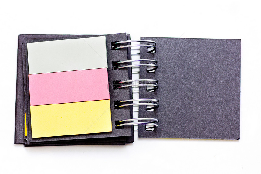 彩色笔记本黄色补给品水平笔记宏观床单粉色备忘录摄影商业图片