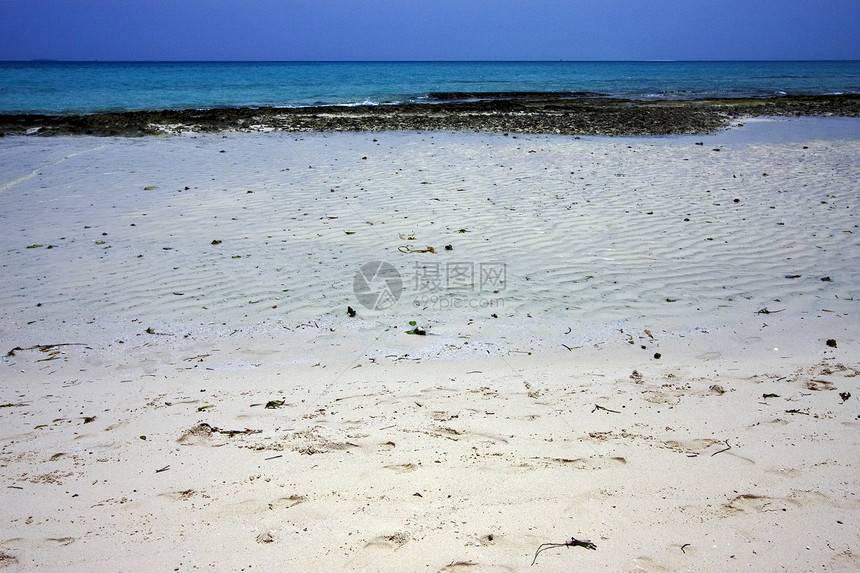 沙滩和沙滩上的沙沙子海滩支撑小岛绿色白色蓝色泡沫黄色海岸线海岸图片