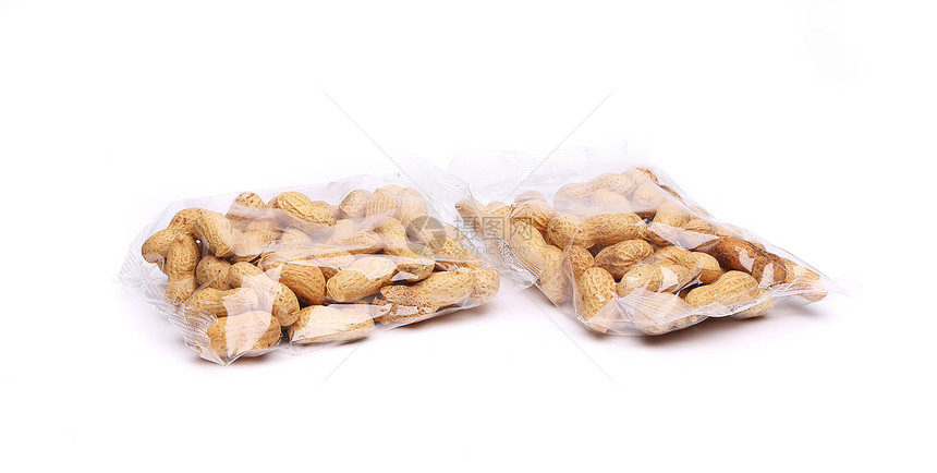 两袋花生塑料袋小吃养分食物坚果白色塑料棕色种子宏观团体图片
