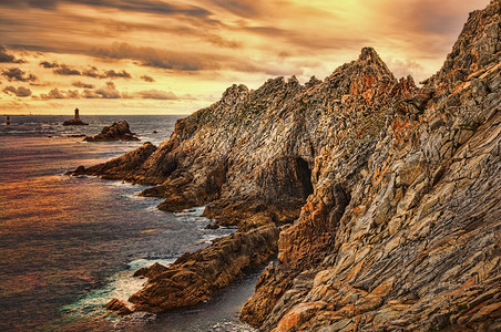 世界末日的太阳落幕地标灯塔海角旅行悬崖海岸线旅游岬角风景海岸背景图片