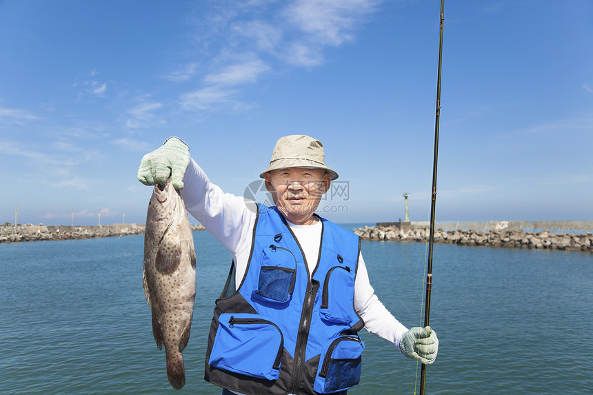 洋人快乐的年老渔夫 展示大块的粉丝图片