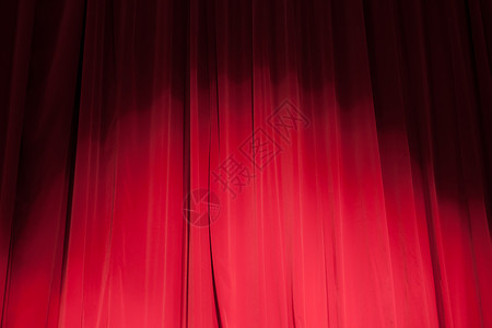 剧场的幕帘和聚光灯窗帘织物艺术喜剧阴影天鹅绒投影歌剧展示夜店背景图片