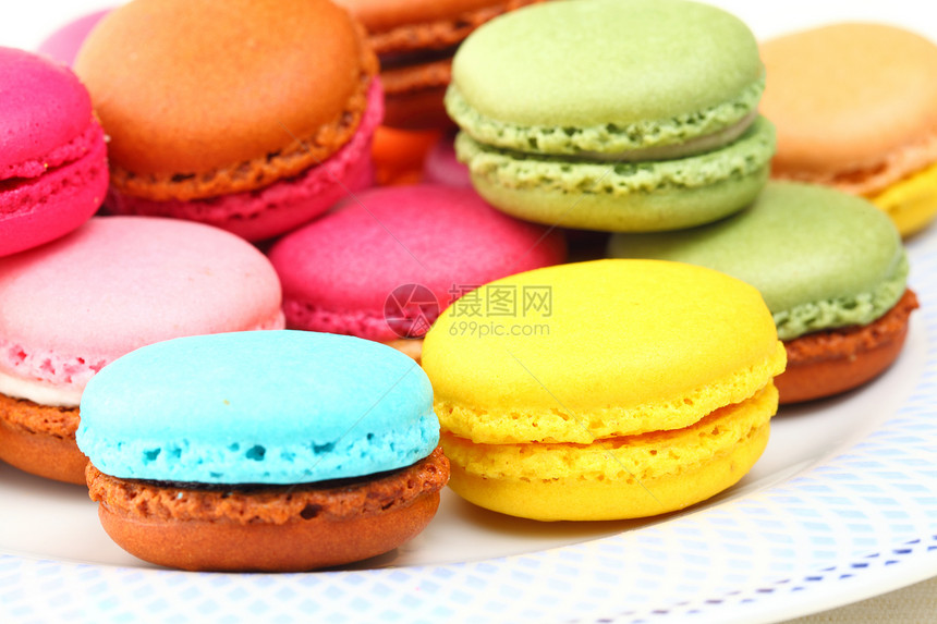 色彩多彩的马卡龙糖果活力小吃甜点时间饼干蛋糕图片