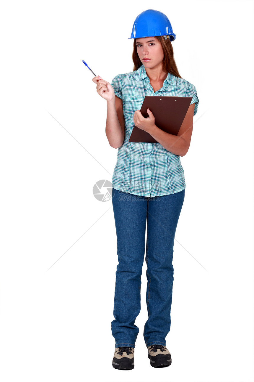手工艺女工持纸巾女士职业蓝色安全牛仔裤头盔人士写作女性白色图片