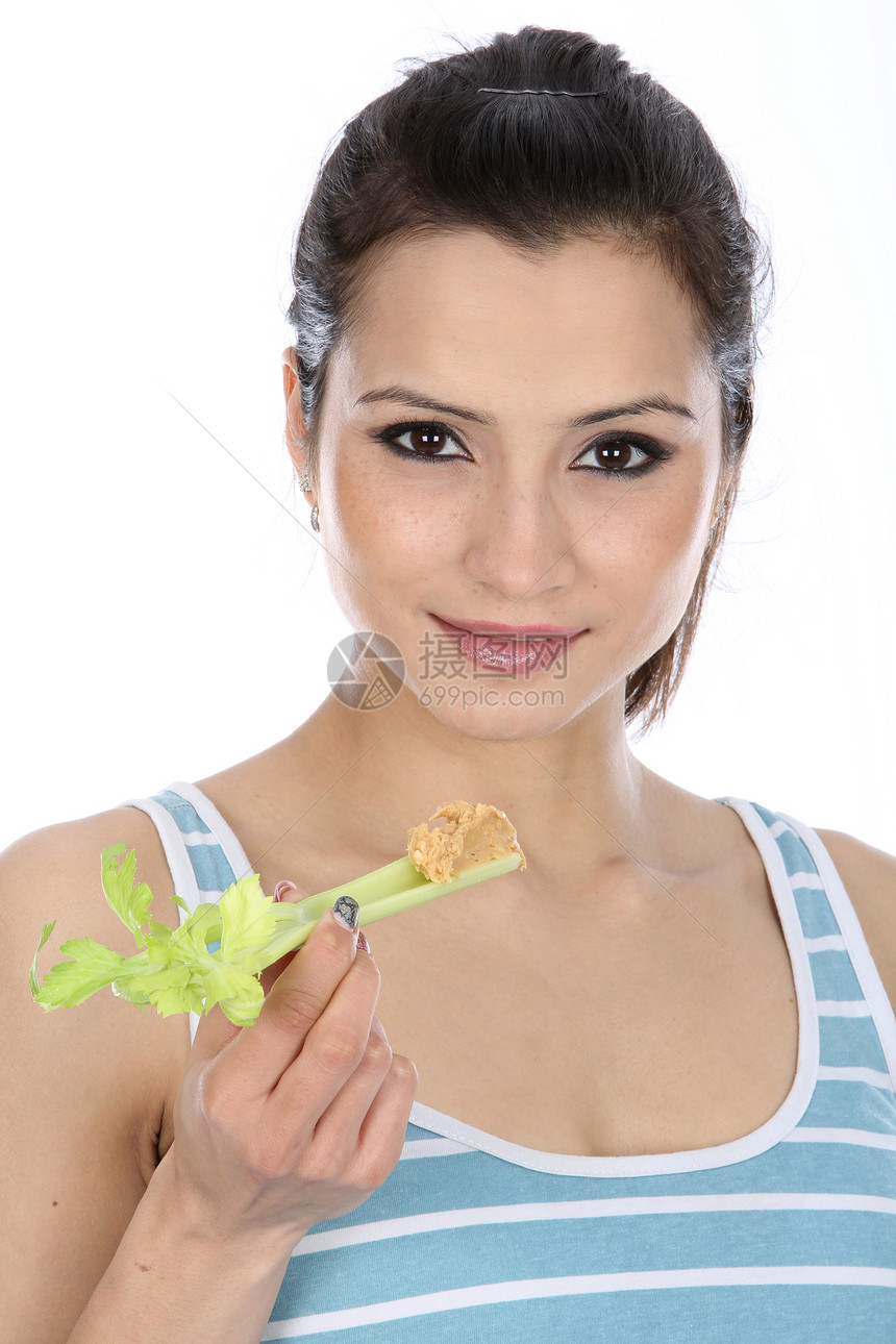女性食用西菜菜和花生酱黄油头发女士芹菜白色图片