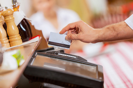 社保缴费收银手的特写机器咖啡店命令咖啡购物卡片出纳员休息收据店铺背景