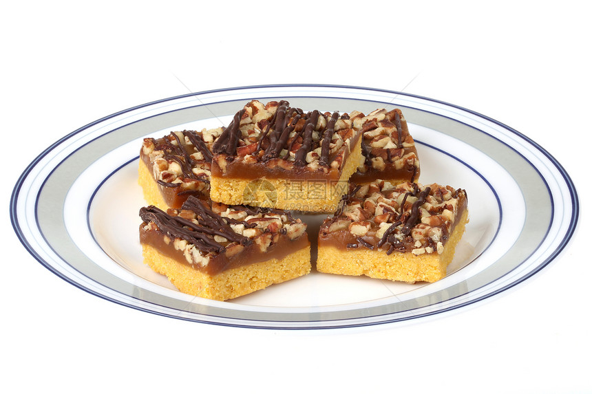 Caramel和Pecan广场白色饼干巧克力食物蛋糕正方形坚果小吃甜点图片