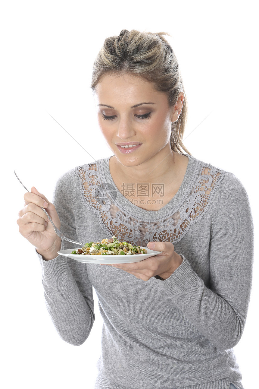 女青年食用全食品沙拉白色女士图片