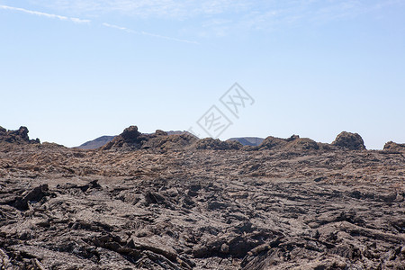 康费蒂兰萨罗特的某个地方海滩旅行阳光荒野天空岩石爬坡目的地时间沙漠背景