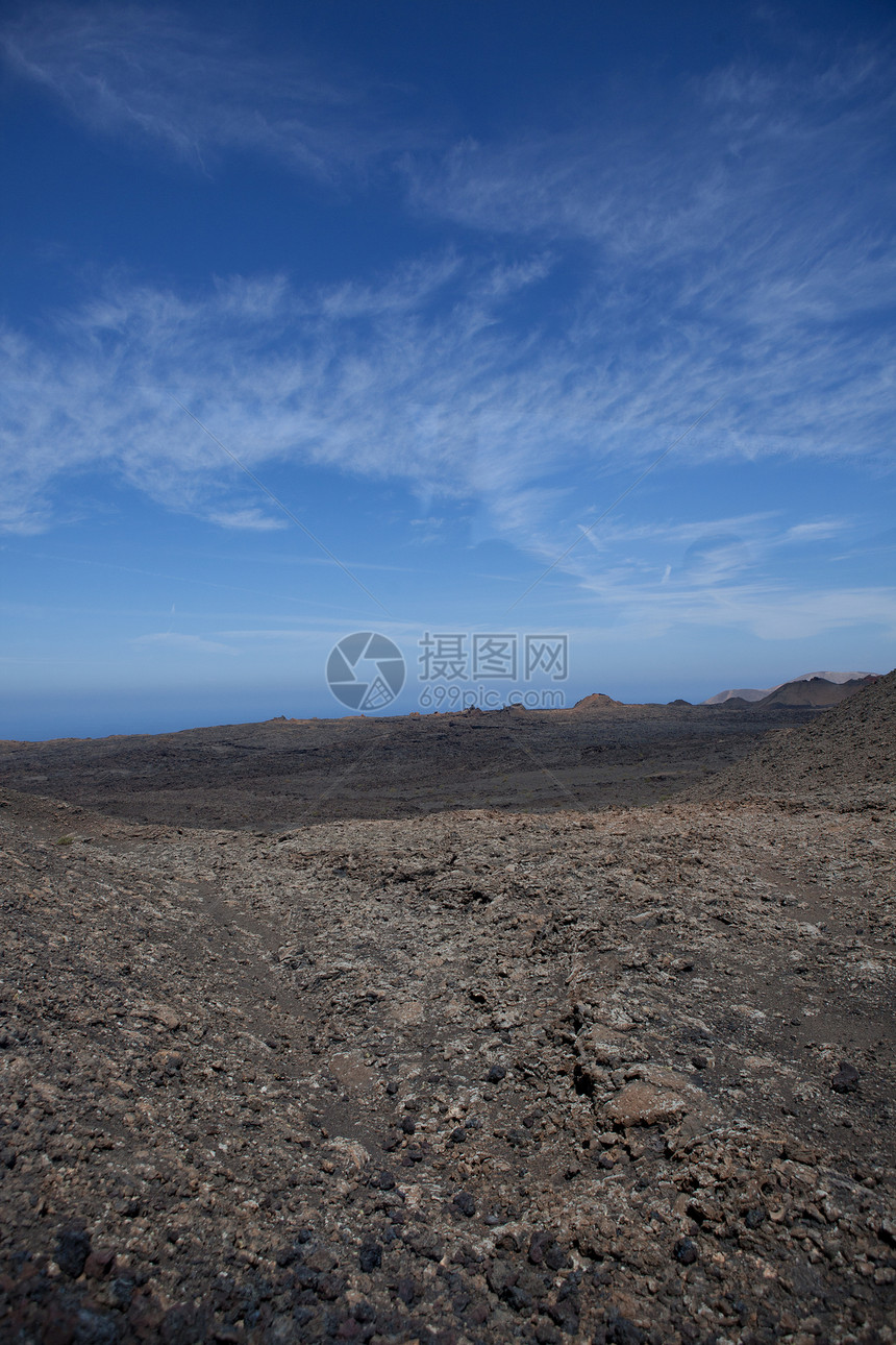 兰萨罗特的某个地方旅行日光阳光沙漠岩石目的地骨灰自然元素爬坡天空图片