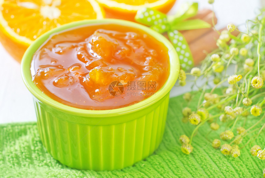 橙果酱营养勺子烹饪玻璃美食木头桌子早餐维生素叶子图片