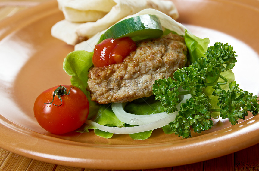 配肉的比塔三明治小吃食物饮食油炸俱乐部蔬菜餐厅白色早餐绿色图片