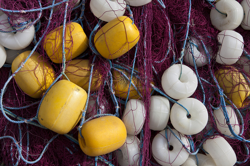 商业捕鱼网的堆积物浮标渔业钓鱼净额绳索图片