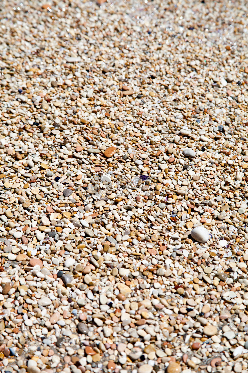 海滩上的石子瓦砾碎石水泥装饰品假期小路砂砾花园花岗岩巨石图片