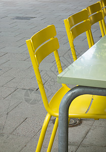 黄椅座位塑料家具椅子黄色背景图片