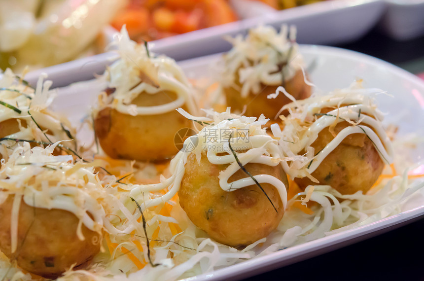 Takoyaki 语句蔬菜油炸盘子海鲜章鱼棕色食物小吃面粉美食图片