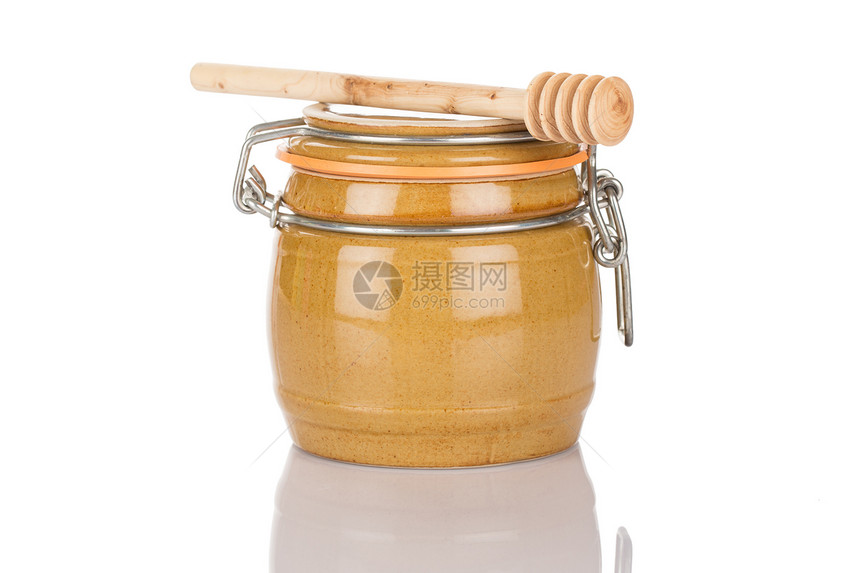蜂蜜锅和棍棒营养宏观木头产品金子用具手工美食食物工作室图片