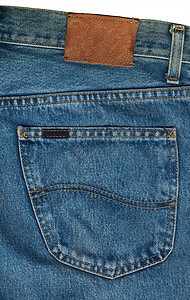 蓝色牛仔裤口袋特写棕色纤维衣服标签框架仔裤服饰接缝棉布裤子背景图片