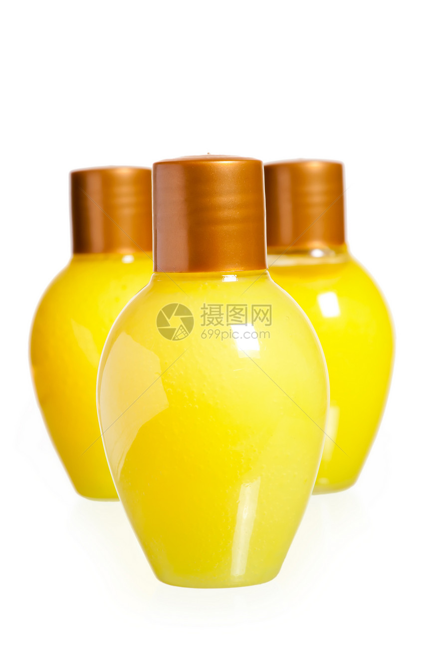 三瓶黄黄色化妆品产品洗发水健康浴室液体洗澡润肤药品芳香玻璃图片