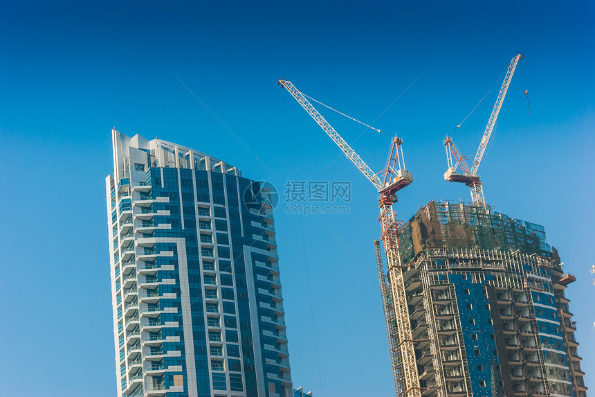 阿联酋迪拜高楼建筑和街道场景建筑学奢华玻璃天空摩天大楼财富景观住宅生长图片