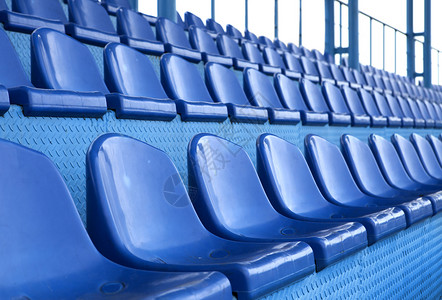 蓝色论坛体育场座位观众竞技场运动椅子剧院塑料游戏团体长椅楼梯背景