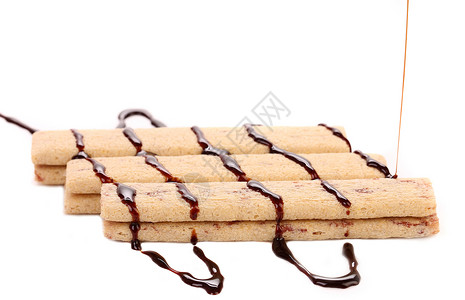 金典口味饼干口味的串流巧克力红色黄色金色蛋糕食物巧克力糕点甜点溪流白色背景