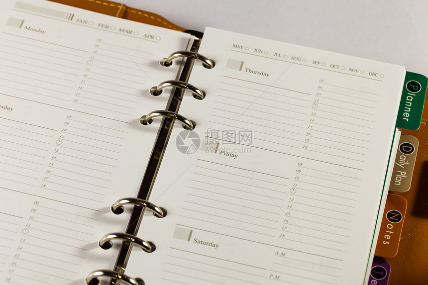 黑色笔记簿组织者对白色背法的特写图像软垫数字商业日程清单办公室床单调子笔记本规划师图片
