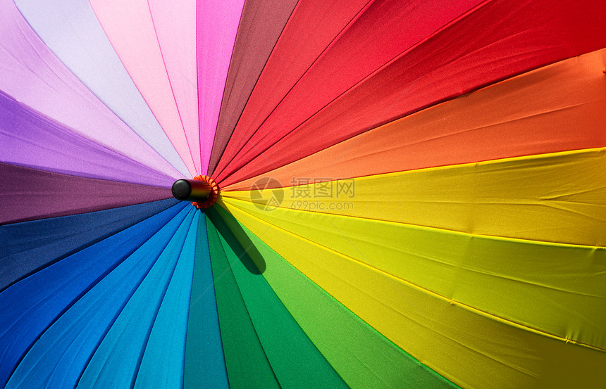 色彩多彩的保护伞庇护所光谱橙子阴影季节彩虹尼龙天气遮阳棚织物图片
