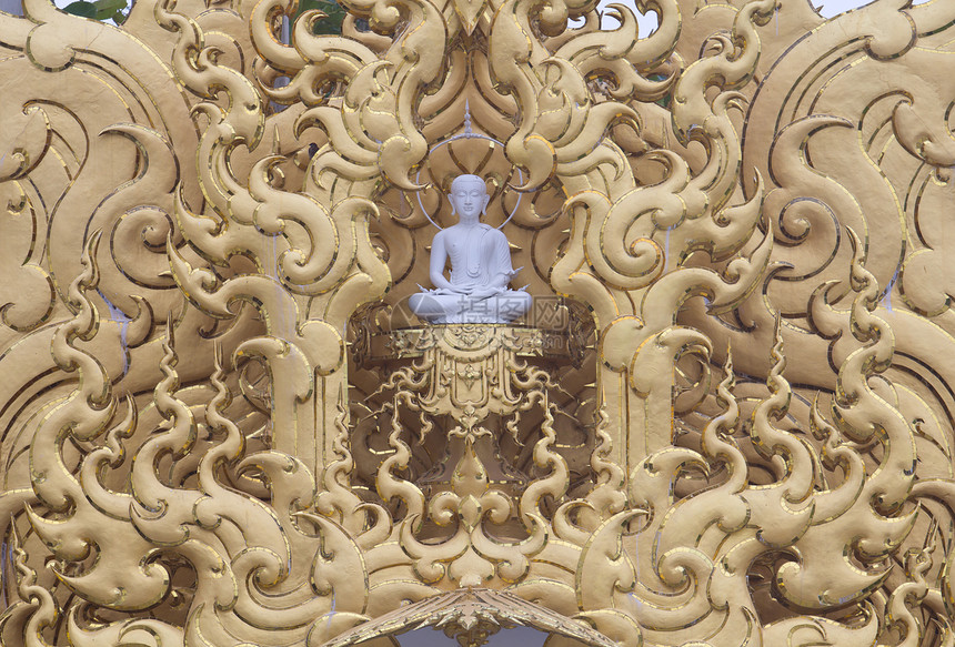 金框中的白佛雕像图片