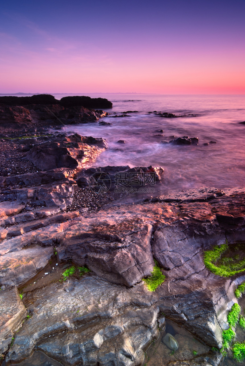 马拉希德的日出风景太阳紫色石头天空旅行天气支撑日落海景图片