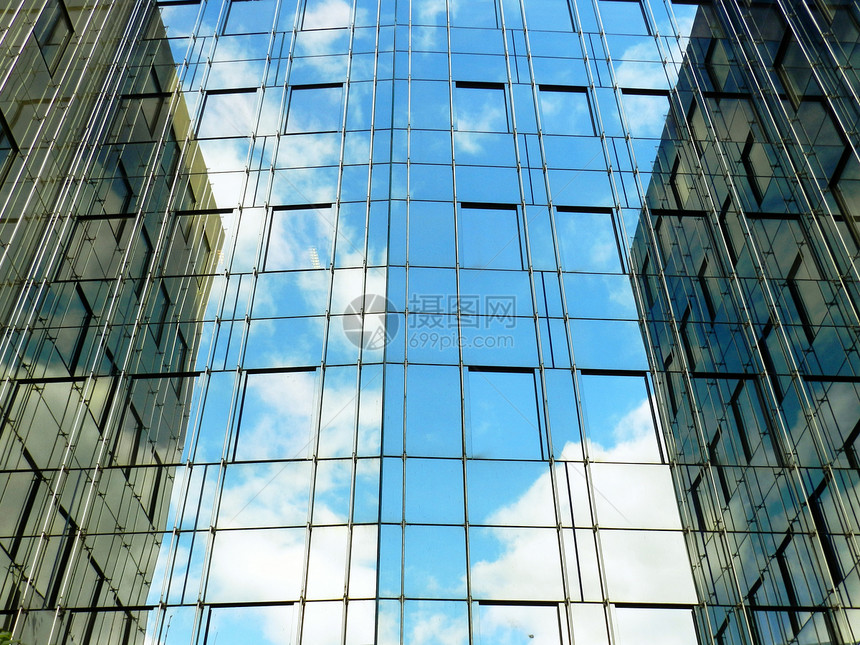 现代办公楼面蓝色天空玻璃商业反射房子建筑办公室图片