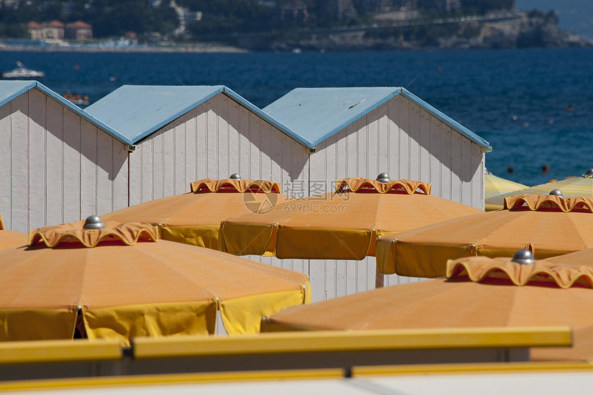 卡瓦纳斯和海滩保护伞海岸阳伞更衣室季节性蓝色旅游橙子小屋黄色沐浴图片