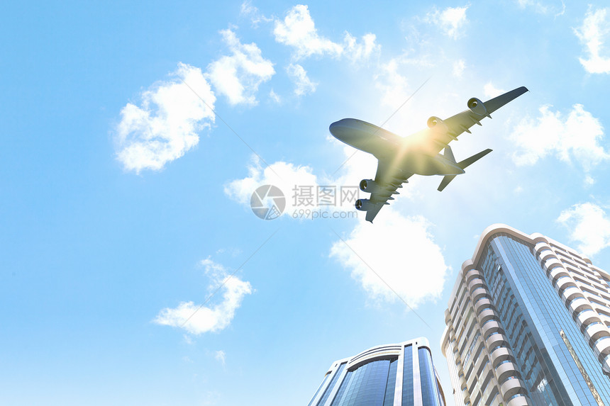 天空中的平地地标公司摩天大楼运输高楼城市喷射飞机建筑建筑学图片