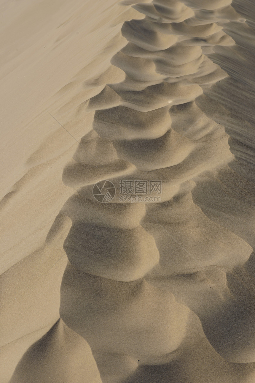 沙砂质侵蚀棕色阴影海浪晴天海滩热带沙漠线条图片
