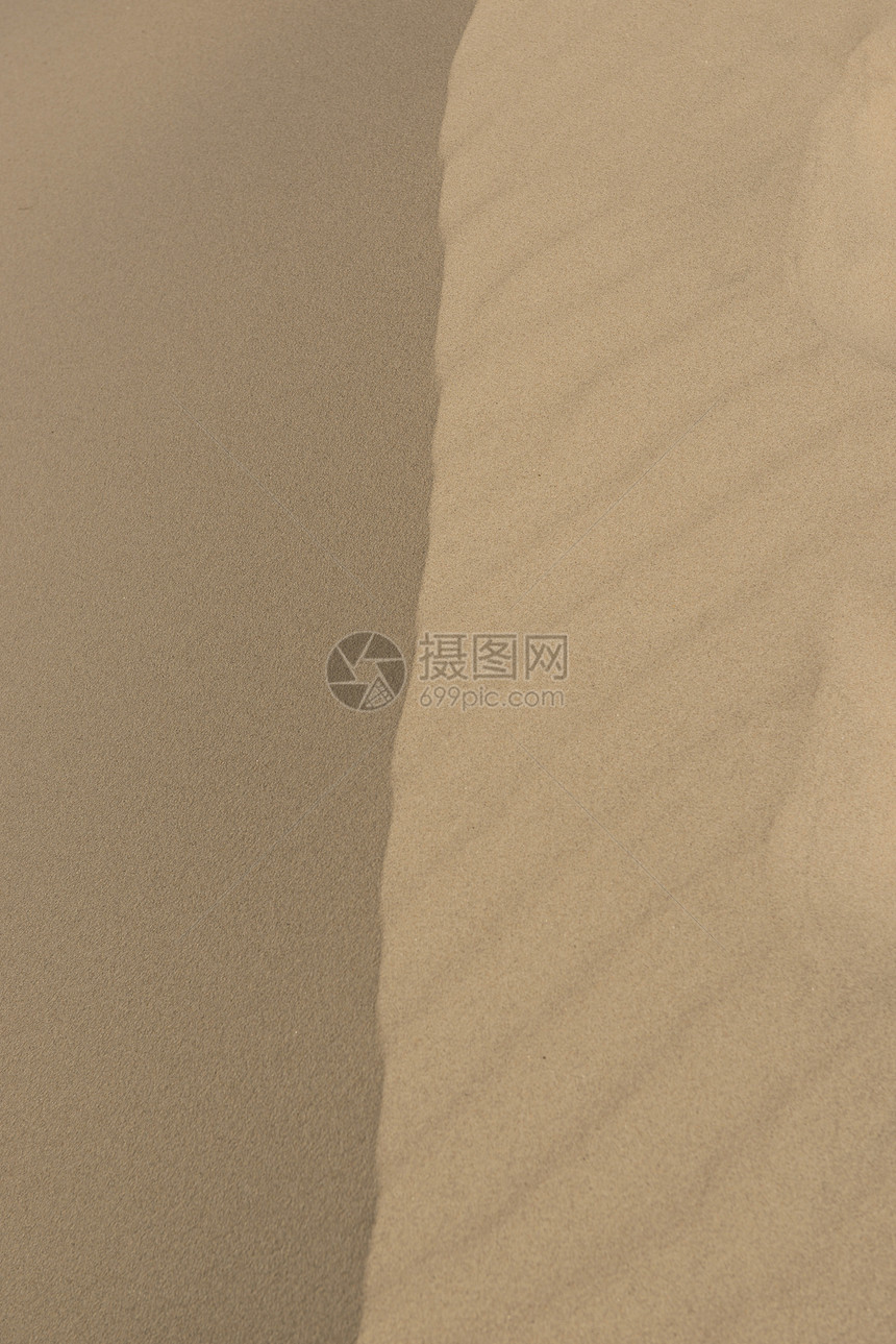 沙砂质阴影侵蚀沙漠晴天海浪热带线条棕色海滩图片