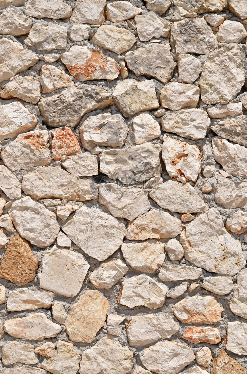 石墙背景材料棕色灰色岩石鹅卵石边界水泥花岗岩力量铺路图片