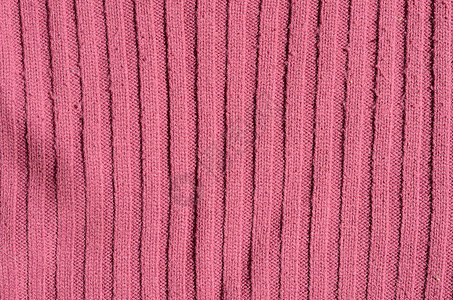 编织结构条纹纤维手工织物粉色毛衣背景图片