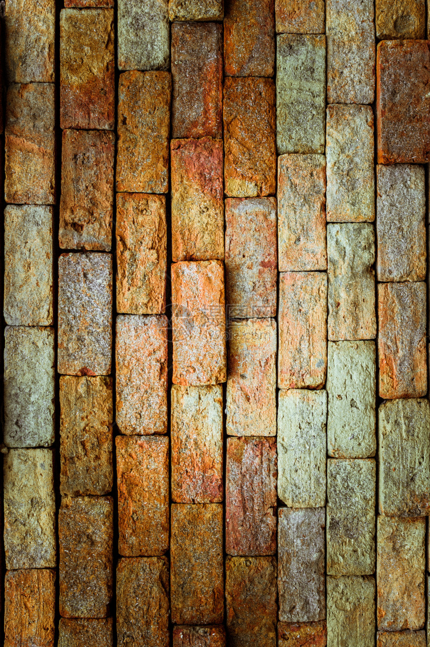 砖墙纹理的 Grunge 背景水泥建筑建筑学墙纸橙子石墙岩石石头砖块材料图片