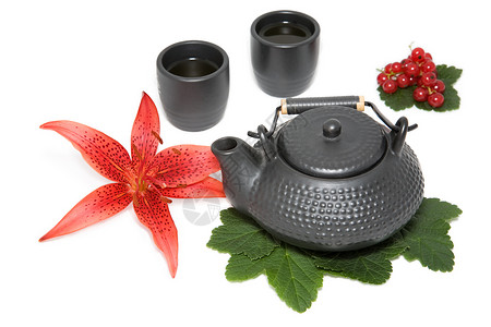 百合果茶壶和两个杯子背景