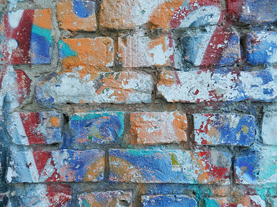旧墙上涂着色彩多彩的涂鸦城市创造力艺术背景图片