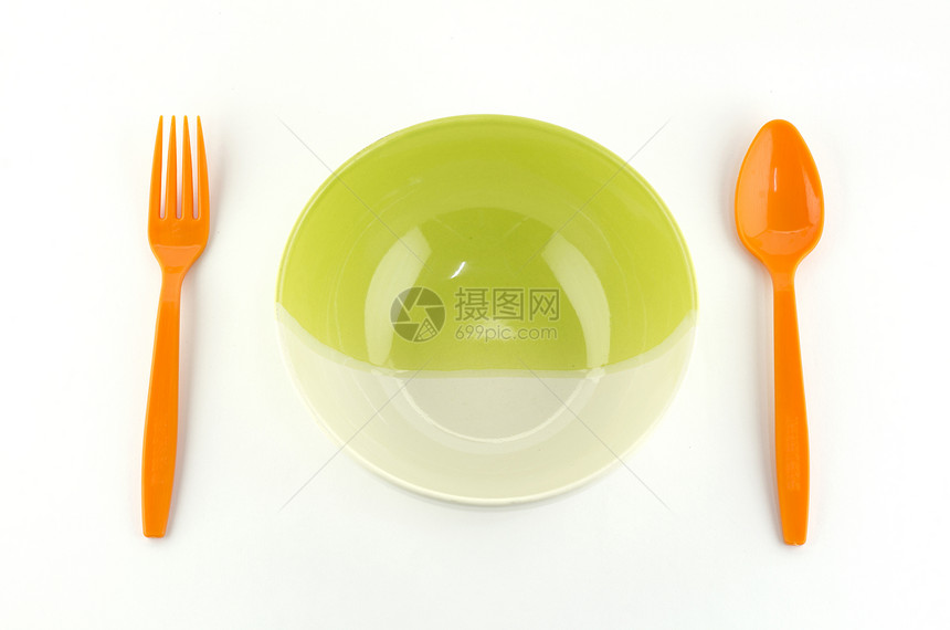 绿色白碗 含橙色勺子和叉子图片