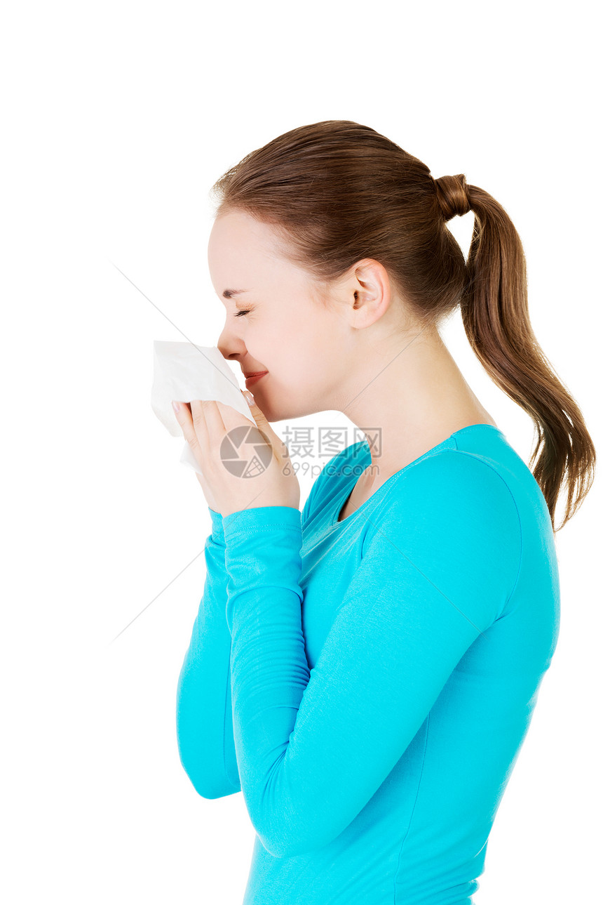 年轻的女人有组织  打喷嚏过敏鼻子治疗疾病成人工作室疼痛组织女孩悲哀图片