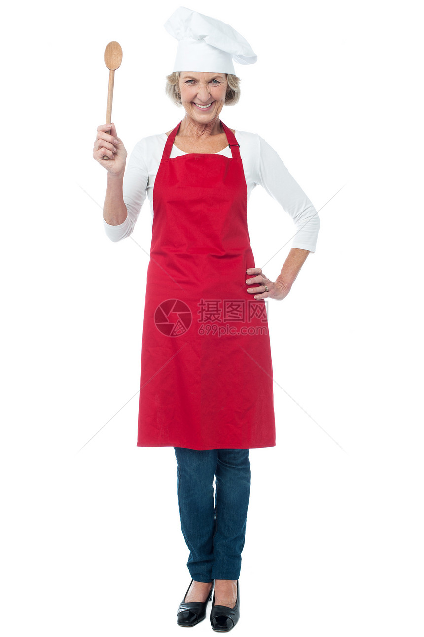 怀着木勺子的快乐老厨师餐饮老太太微笑钢包商业用具转矩女士女性厨房图片