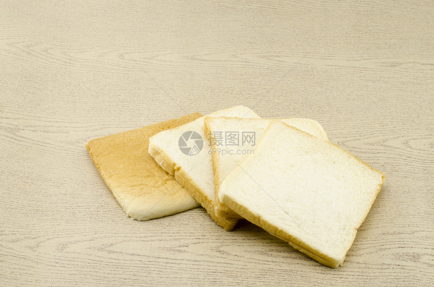 褐木上切片面包面团营养烹饪美食饮食厨房谷物午餐小吃粮食图片