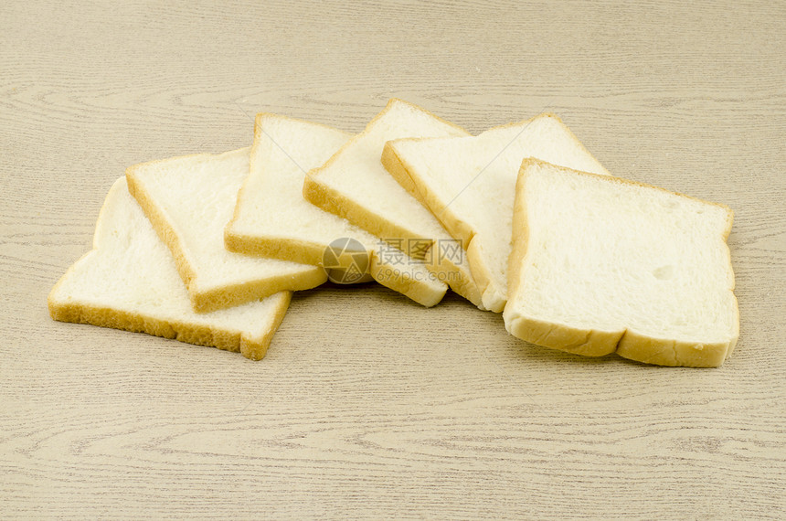褐木上切片面包饮食午餐食物谷物烹饪美食脆皮厨房碳水化合物图片