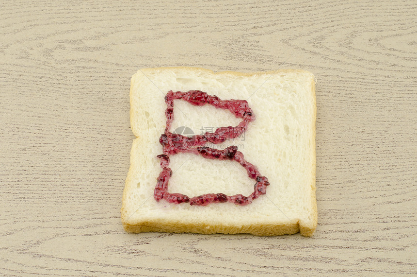 切片面包上的果酱字母表厨房面团午餐碳水烹饪早餐粮食谷物小吃化合物图片