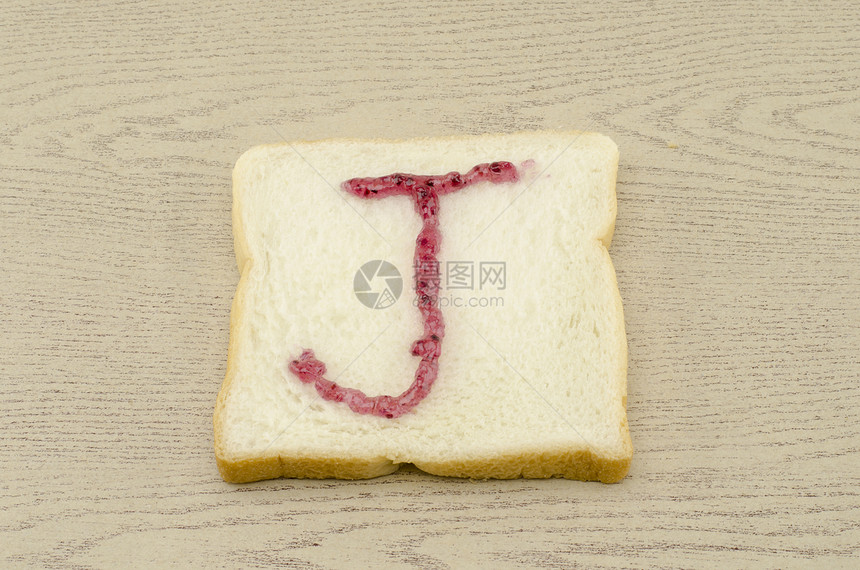 切片面包上的果酱字母表化合物美食午餐食物小麦小吃脆皮谷物粮食碳水图片