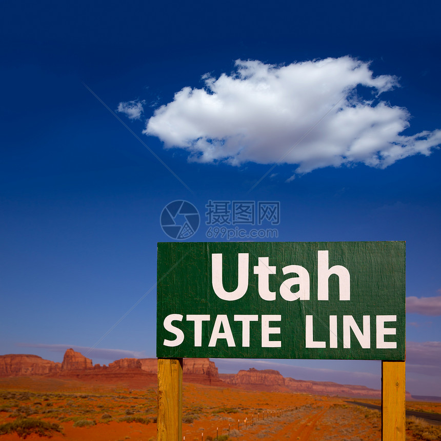 犹他州与亚利桑那州线之间的公路标志蓝色纪念碑国家干旱沙漠地平线信号招牌标语公园图片